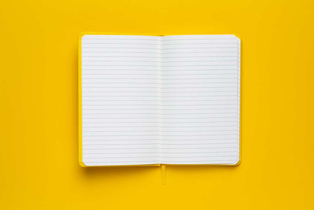 Five year diary on a yellow background.